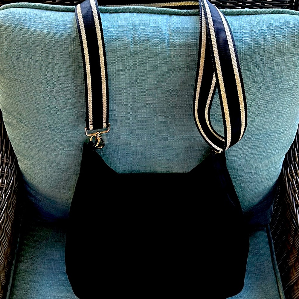 This is a black Prada crossbody with matching wallet.